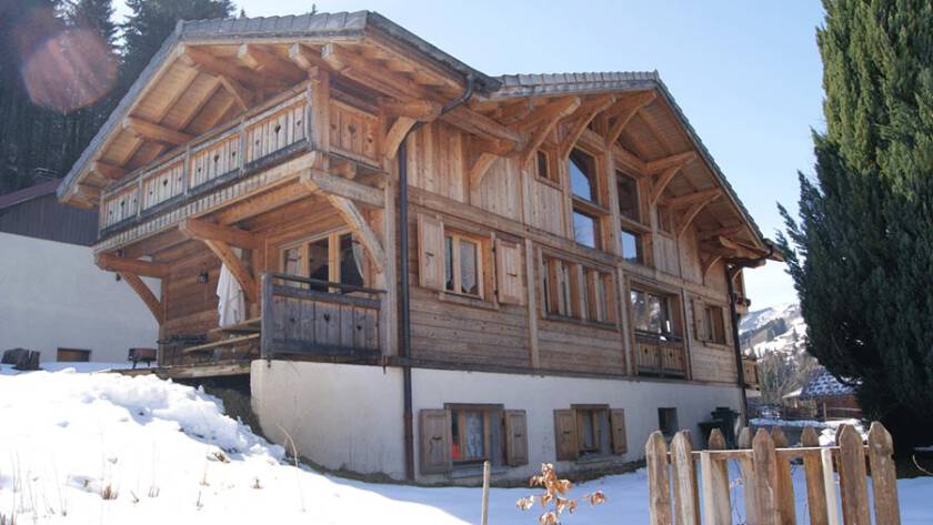 chalet in morzine with snow and sun