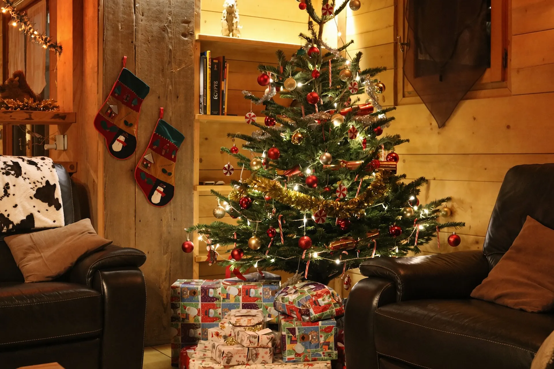 Luxury chalet Morzine decorated for Christmas with a real tree and wood burning fire
